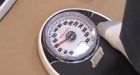 A third of U.S. firms pay or penalize staff over weight